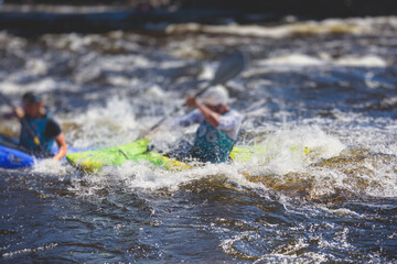 Kayak slalom canoe race in white water rapid river, process of kayaking competition with multiple...