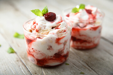 Homemade meringue dessert with raspberry and cream
