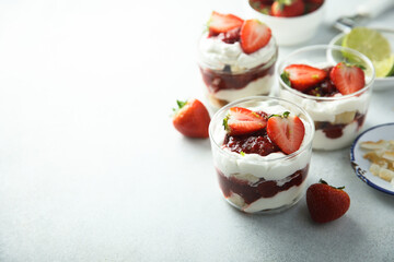 Homemade berry trifle with almond flakes