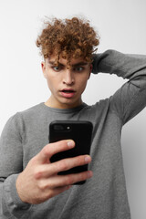 Attractive man looking at the phone fashion isolated background