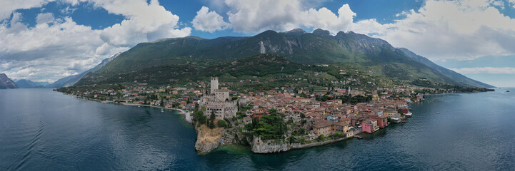 The historic town of Malcesine on Lake Garda, Italy. Castle on Lake Garda top view. Castle of Malcesine, panorama aerial view.