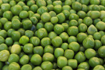 Close up shot of fresh green Peas. Food texture and background
