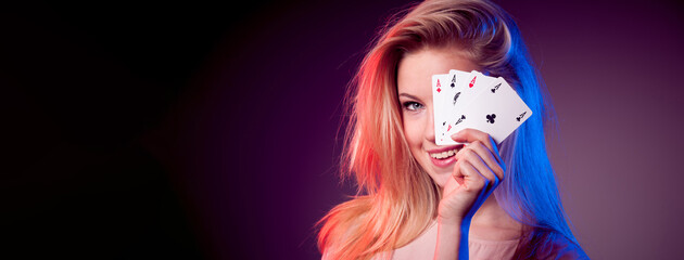 Beautiful caucasian woman with poker cards gambling in casino	