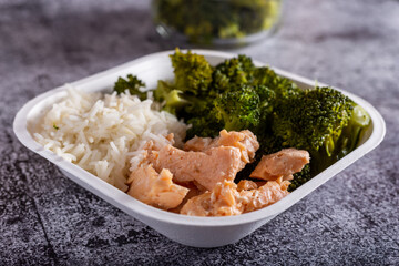 Bowl with salmon, basmati rice and broccoli.