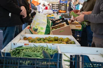 Foto op Canvas People buying vegetables in the market, tomatoes, beans, bananas, kiwis... © Elizabeth
