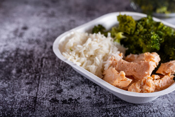 Bowl with salmon, basmati rice and broccoli.