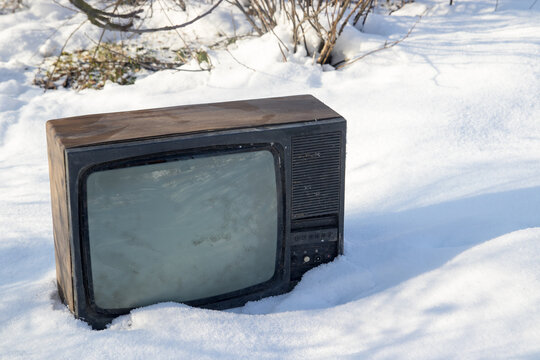 Vintage TV set thrown in the snow