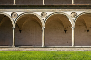 Large cloister in the Santa Croce church in Florence, Italy