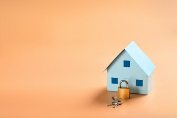 House model and padlock with copy space: protection and security concept