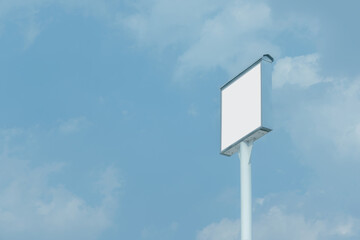 White empty billboard sign mockup for advertisement, information or banner with blue sky in the background.