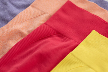 Colourful sports leggings isolated on grey background.