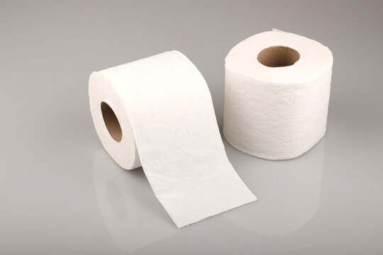 White toilet paper isolated on grey background.