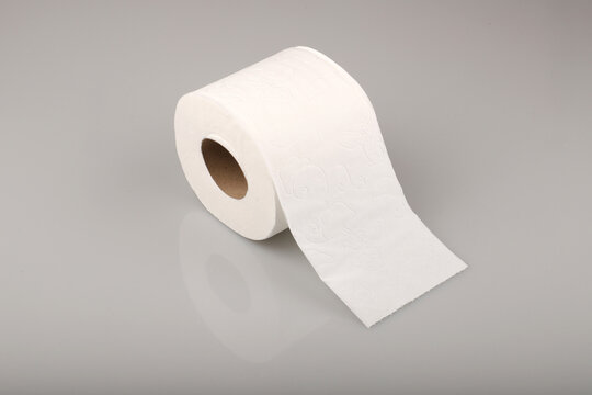 White toilet paper isolated on grey background.
