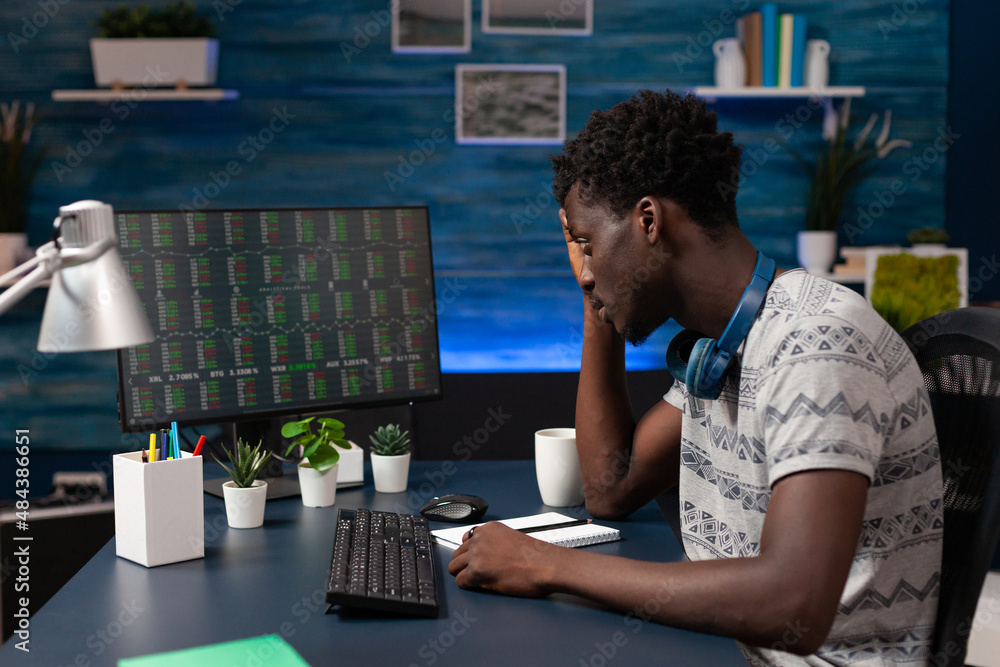 Poster african american trader looking at stock market analyzing crypto currency growth on computer working