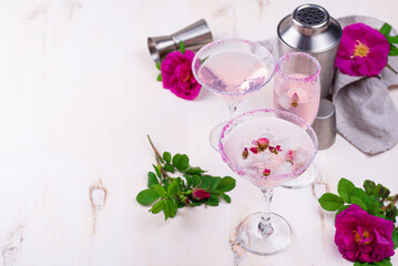 Assortment of pink cocktails with rose syrup.