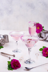 Assortment of pink cocktails with rose syrup.