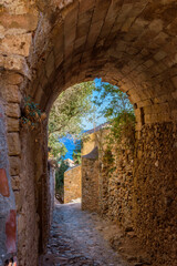 Naklejka premium View of traditional architecture and yellow stone's arch from the medieval castle of Monemvasia, Lakonia, Peloponnese.