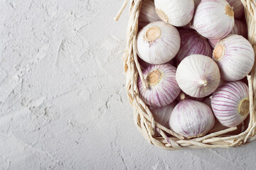 Garlic in a basket top view with copy space