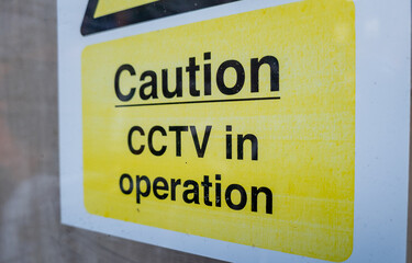 A warning notice that CCTV is in operation.