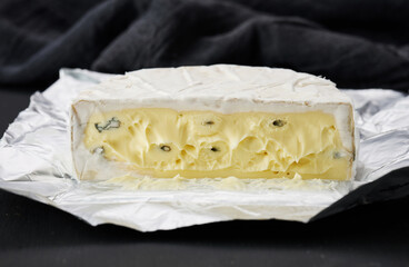 bergader blue cheese on a black board, delicious snack