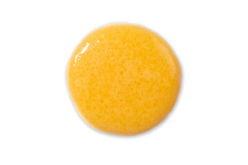 Mango or orange body scrub swatch isolated on white. Beauty skincare product smear. Flatlay.