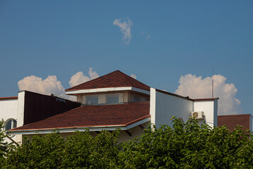 detail of roof of the house against blue sky