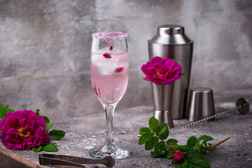 Pink cocktail with champagne and rose syrup