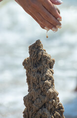 sand castle on the beach near the water. High quality photo