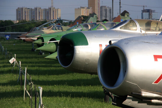 View of MiGs parked in line at the Ukraine State Aviation Museum - MiG-19 and MiG-17 in the foreground, MiG-21, MiG-23 and MiG-27 in the background
