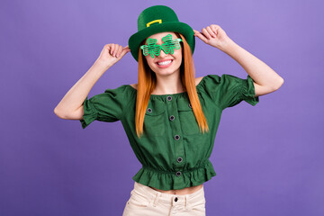 Photo of shiny charming young lady wear green blouse cap celebrating st patrick day smiling...