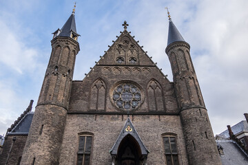 Fototapeta premium Fragments of Ridderzaal (Hall of Knights, XIII century) in Binnenhof (Inner court) - XIII century complex of buildings in the city center of Den Haag (The Hague). The Netherlands.