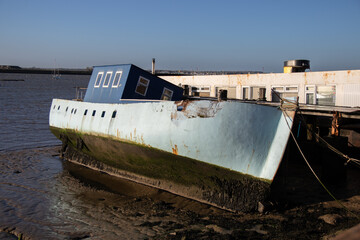 A boat on the bank of the River Crouch at Burnham-on-Crouch, Essex 