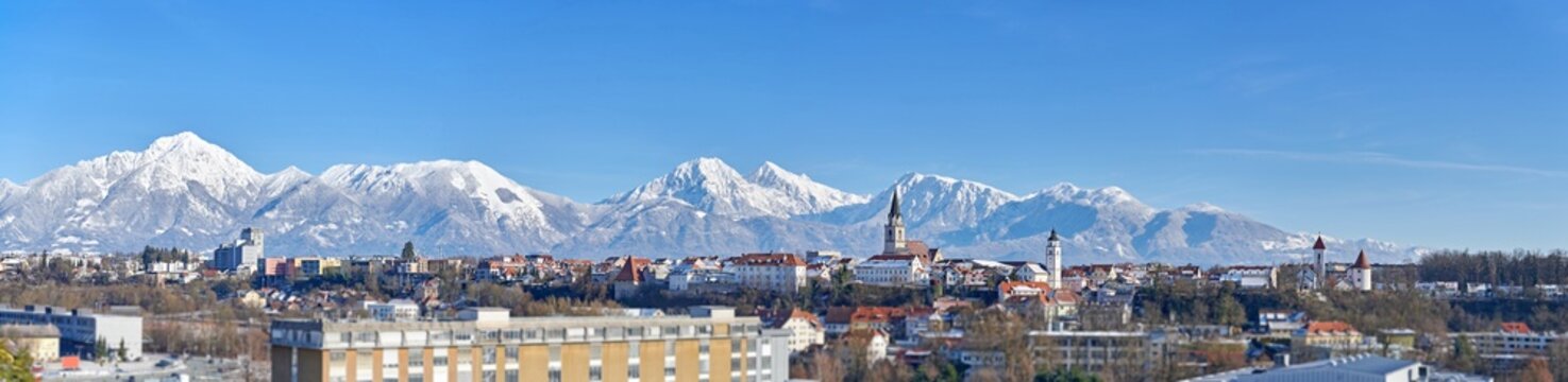 Winter Panorama of Kranj, Slovenia, Europe.
Kranj in Slovenia with St. Cantianus Church in the foreground and the Kamnik Alps behind.