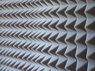 Grey acoustic foam rubber. Soundproof pyramids, full frame.
