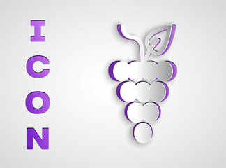 Paper cut Bunch of grapes icon isolated on grey background. Paper art style. Vector