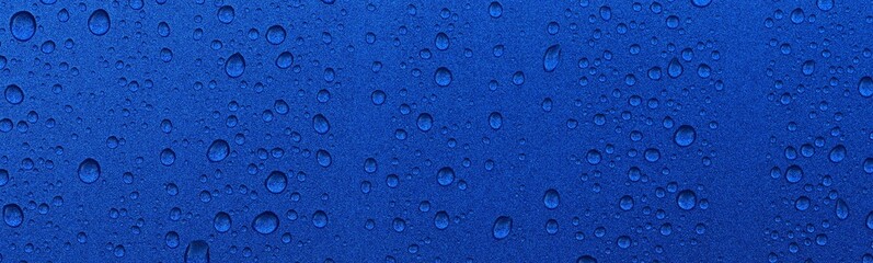 Bright blue background, crystal clear drops (raindrops). Abstract pattern, wallpaper, concept art. Glitter, paint texture. Graphic resources, design, 3D, macrophotography, environment, water treatment