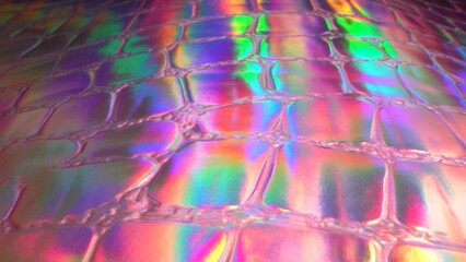 Holographic pink neon purple ultraviolet metallic background. Rainbow iridescent texture close up