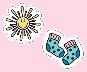 Two stickers with sun and baby socks