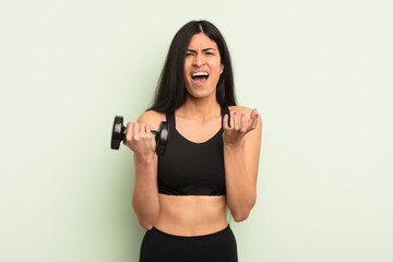 young pretty hispanic woman looking desperate, frustrated and stressed. fitness concept