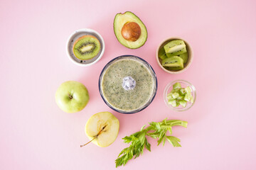 Electric hand blender with fruits and ready smoothies on a pink background. Flat lay.