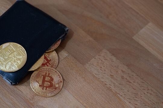 Bitcoins and crypto currentcy wallet close up and copy space.