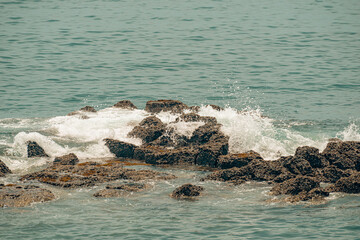 waves crashing against the rocks