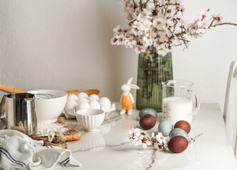 Easter culinary background. Easter food ingredients composition on the kitchen table and copy space for a text menu or recipe