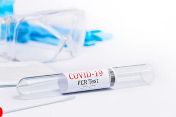 Kit tested Covid-19 , Coronavirus symptoms medical concept with PPE and Swab PCR test on white...