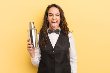 young pretty hispanic woman with cheerful and rebellious attitude, joking and sticking tongue out....