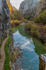 view from Kokori's old arch stone bridge (Noutsos) during fall season  situated on the river of Voidomatis in  Zagori, Epirus Greece.