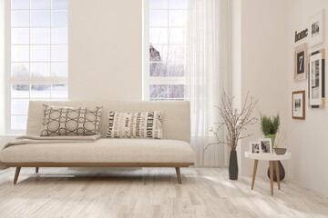 White living room with sofa and winter landscape in window. Scandinavian interior design. 3D illustration