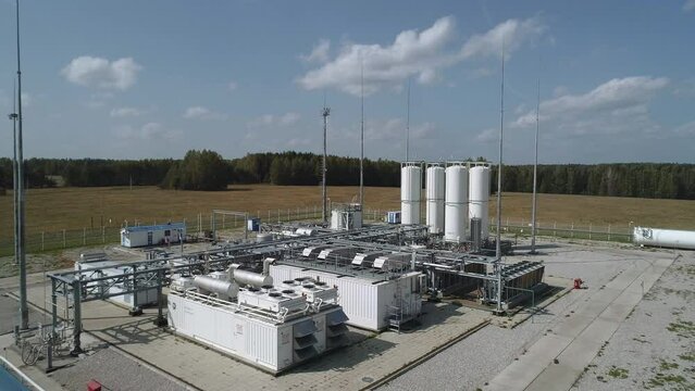 Compressor station for the production of oxygen and nitrogen. Plant for the preparation of oxygen for covid hospitals. Drone flies over industrial buildings and tanks