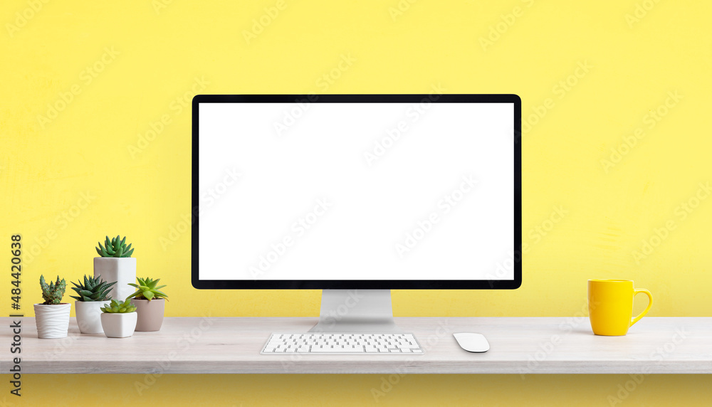 Poster creative work desk with blank computer display, yellow coffee mug and plants. yellow background with
