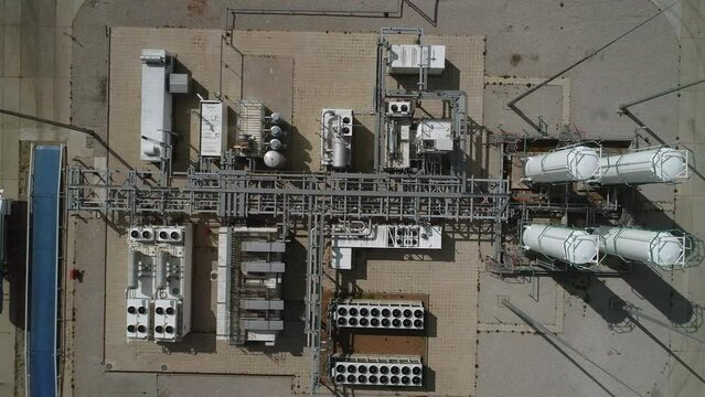 Top view of the compressor station for the production of oxygen and nitrogen. Plant for the preparation of oxygen for covid hospitals. Drone flies over industrial buildings and tanks